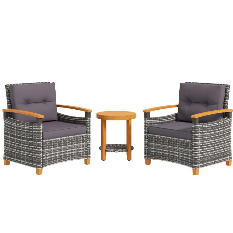 Wicker bistro set with two gray cushioned chairs and round wood side table