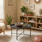 Round coffee table with hammered tray top, dark metal frame, and sturdy metal legs