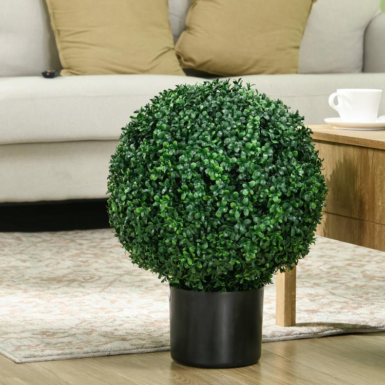 Artificial ball topiary tree in a matte black pot with dense green leaves.
