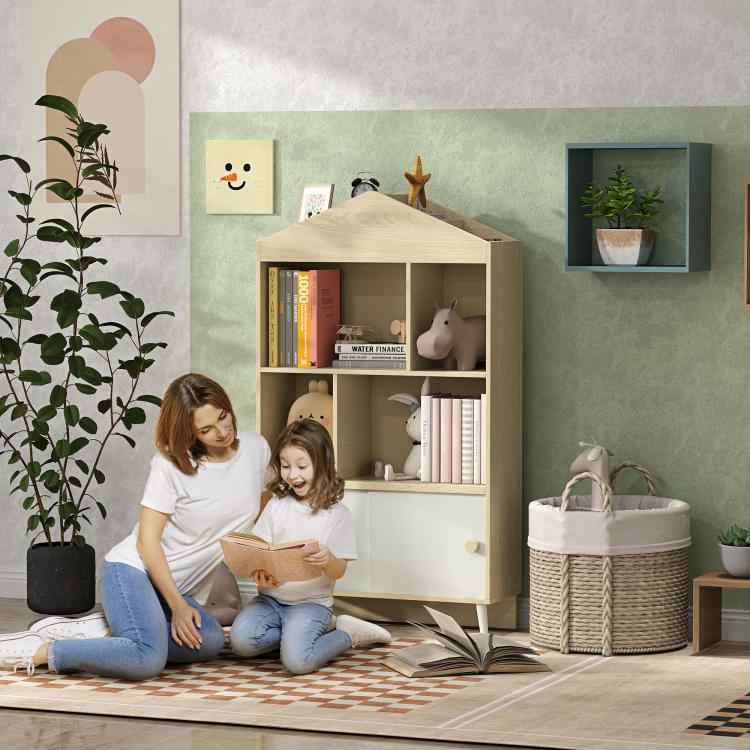 Light wood kids storage bookshelf with open shelves, toys, and lower cabinet doors