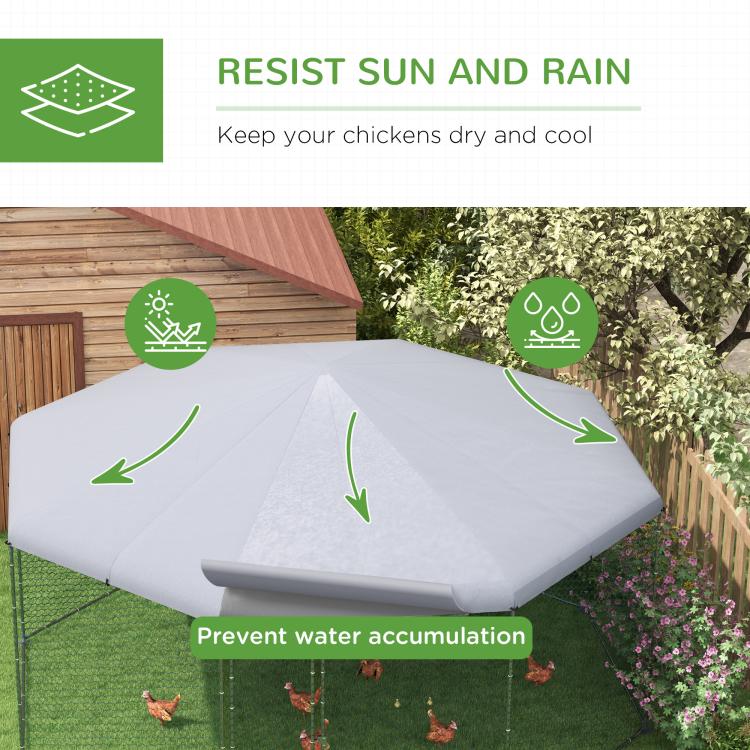 Chicken run with gray waterproof-style cover and wire mesh sides over grass