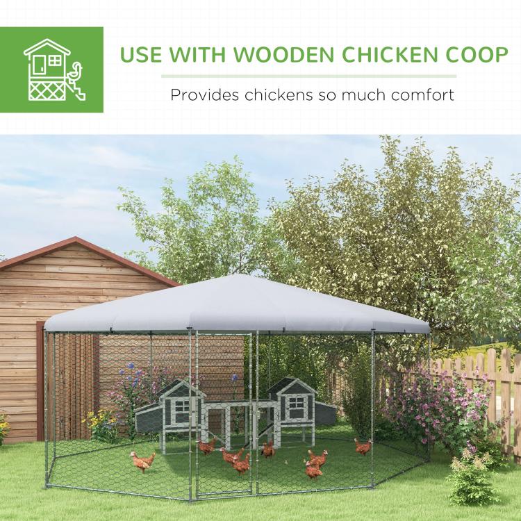 Large chicken run enclosure with gray roof cover and wire mesh walls