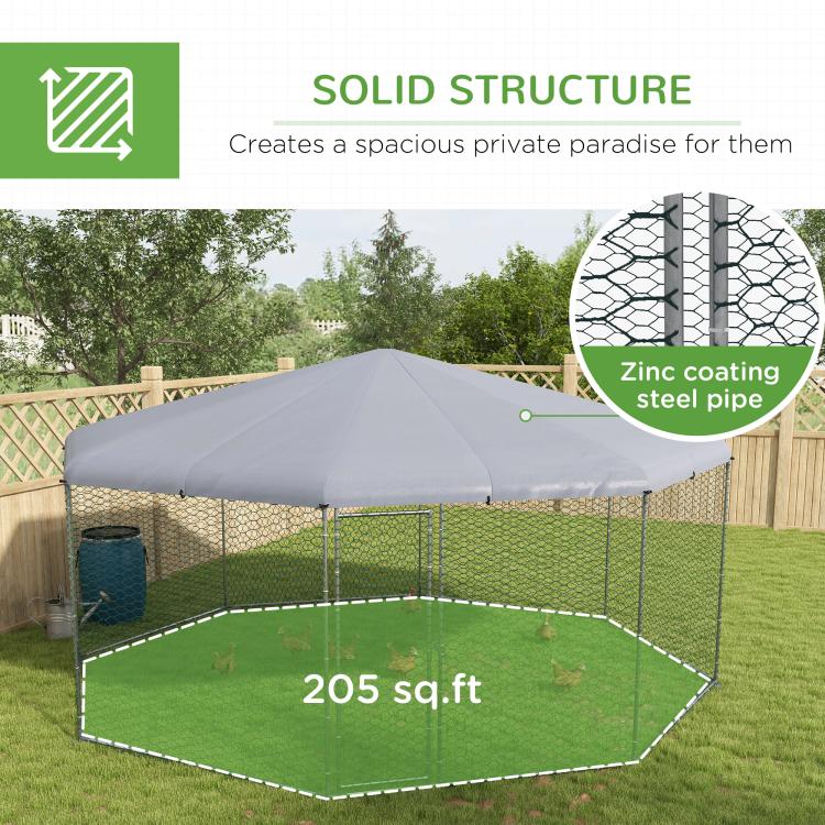 Chicken run with gray canopy and hex wire mesh, shown from angled outdoor view