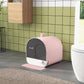 Pink covered cat litter box with dark door and pink mat in front