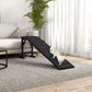 Black dog ramp with textured non-slip carpet, white dog on ramp near living room