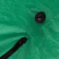 Inflatable Halloween ghost display with black air valve on green fabric