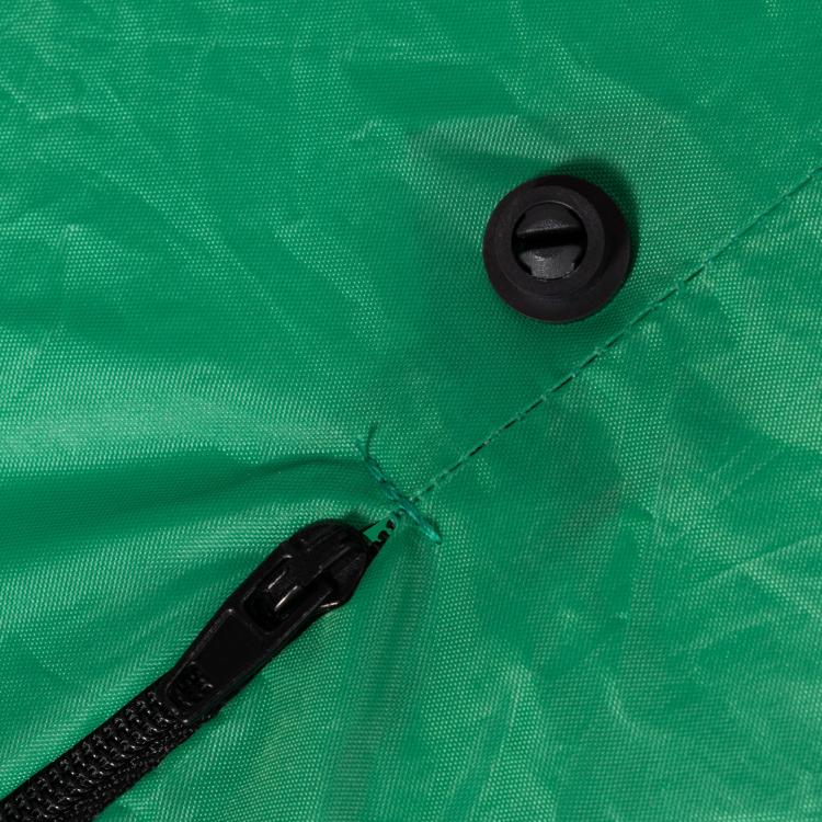 Inflatable Halloween ghost display with black air valve on green fabric
