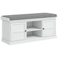 White shoe storage bench with gray cushioned seat, three compartments and central open shelf