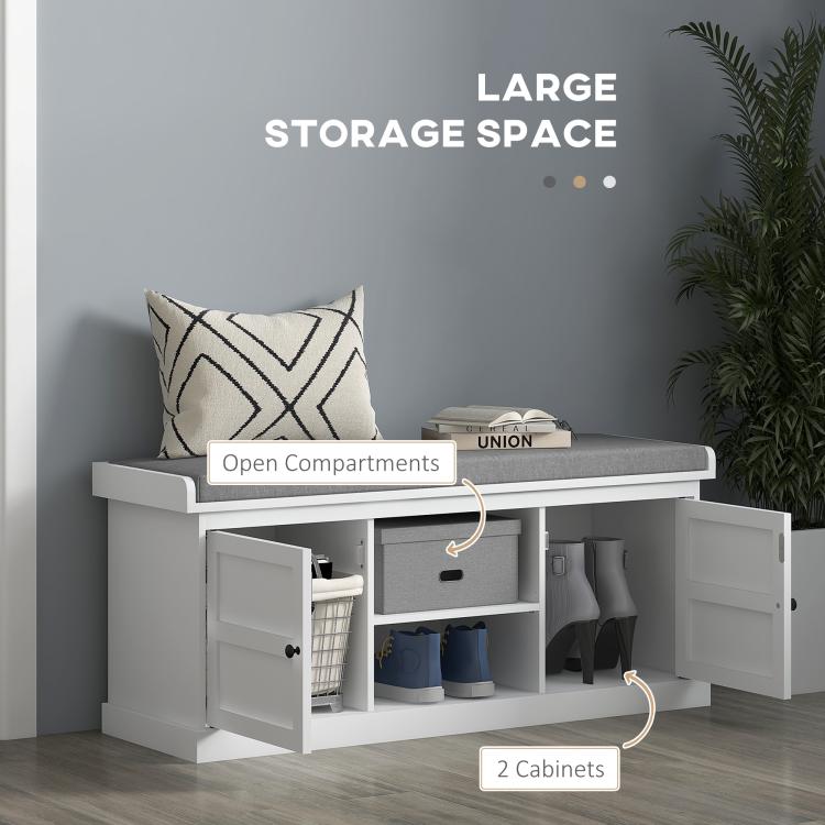 White shoe storage bench with open compartments, gray cushioned seat, and two cabinet doors