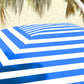 Blue and white striped cabana umbrella canopy close-up