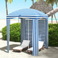 Blue-and-white striped beach cabana umbrella with open walls and interior seating