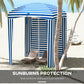 Blue-and-white striped cabana umbrella with open walls and canopy over seating