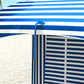 Blue-and-white striped cabana umbrella side panel with blue support frame and canopy edge