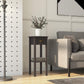 Charcoal side table with drawer and open shelf beside a sofa