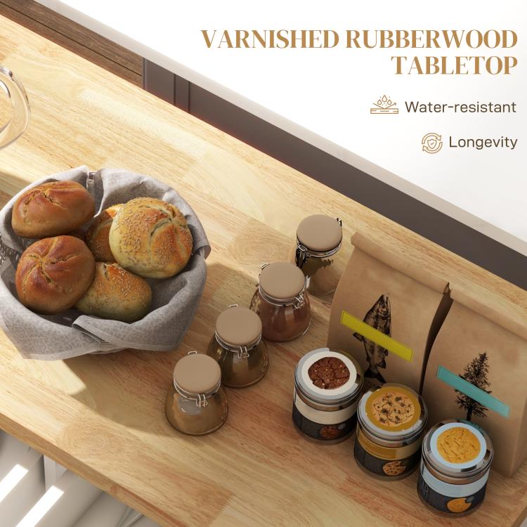 Rubberwood tabletop on white rolling kitchen island with spice jars and bread basket
