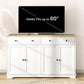 White sideboard cabinet with open storage doors and top surface for TV