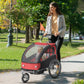 Black and red kids bicycle cargo trailer with covered top and curved front housing