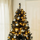 Prelit artificial Christmas tree with realistic dark branches, warm white LEDs and baubles