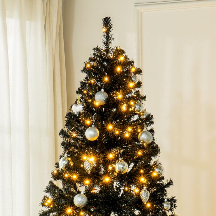 Prelit artificial Christmas tree with realistic dark branches, warm white LEDs and baubles