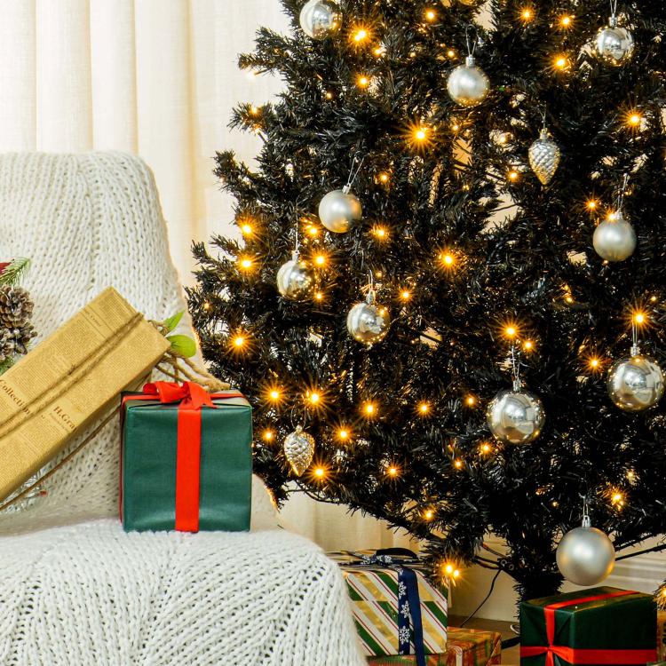 Close-up of 7.5 ft pre-lit Christmas tree with warm white LEDs and silver bauble ornaments