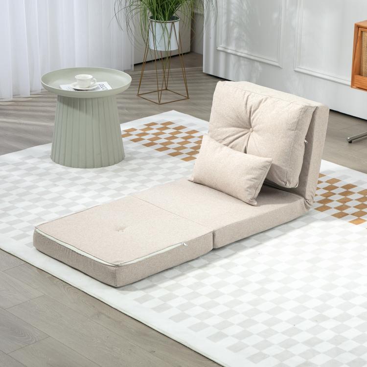 Beige convertible floor sofa bed with upright back cushion and two pillows