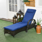Outdoor chaise lounge with blue cushion, headrest, and wicker armrests with wheels