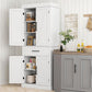 White kitchen cabinet pantry unit with barn doors, shelves, and drawer below