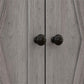 Gray cabinet doors with two round dark knobs