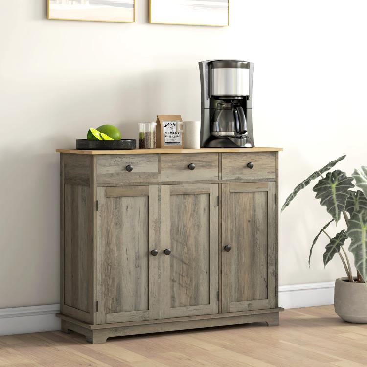 Distressed gray storage cabinet with wood top and cabinet doors with black knobs.