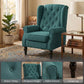Dark green wingback accent chair with button-tufted back, rolled arms, and turned wood legs