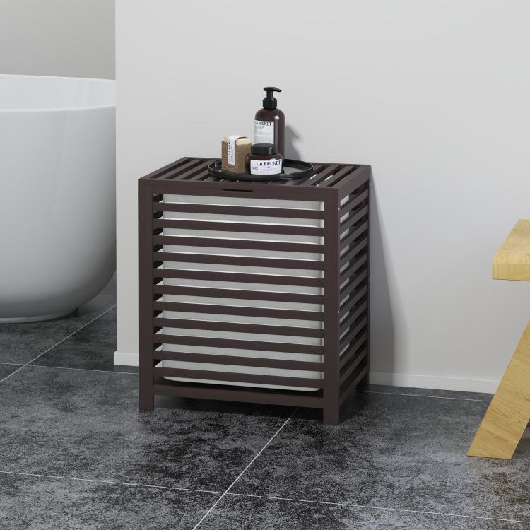 Coffee bamboo laundry hamper with slatted lid, with toiletries bottles on top