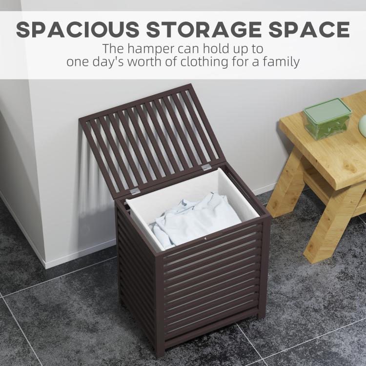 Coffee laundry hamper with lid open and white liner bag holding folded clothes