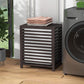 Coffee bamboo laundry hamper with lid closed and folded towels on top