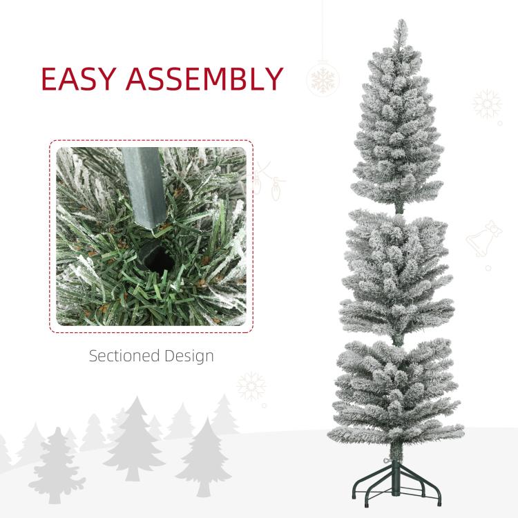 Snow-frosted artificial pencil Christmas tree on metal stand, sectioned design