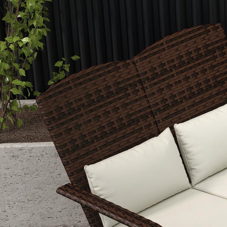 Dark wicker 2-person Adirondack chair with cream cushions and high back, close-up