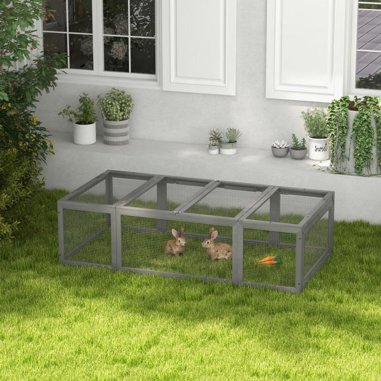 Gray rabbit hutch with wire-mesh sides, two rabbits inside, enclosed outdoor run