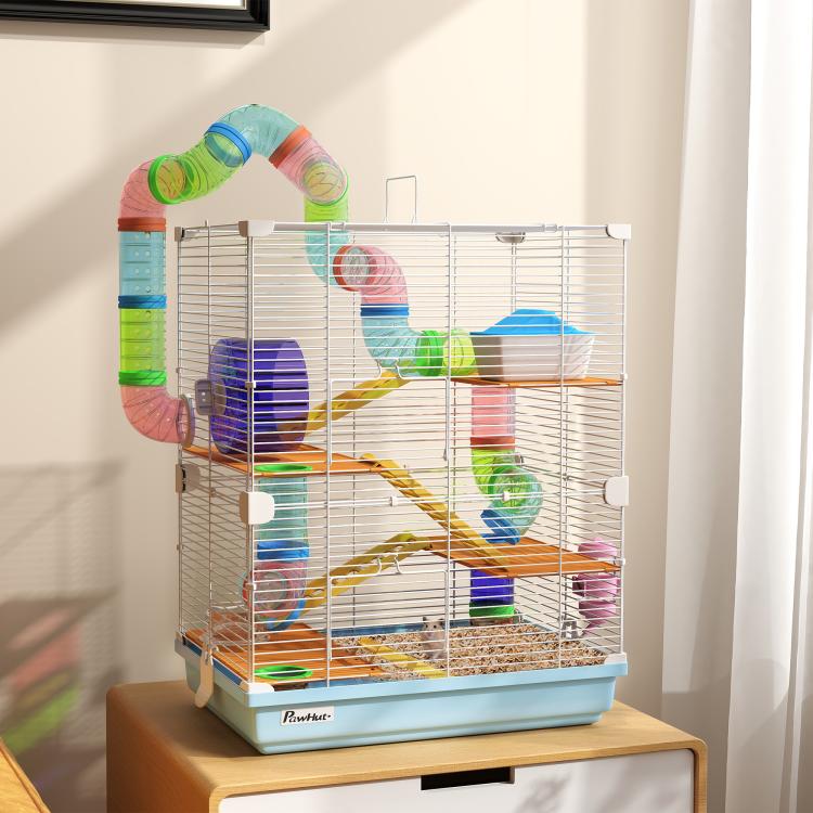 Light blue multi-level hamster cage with white wire panels, ramps, and connecting tubes