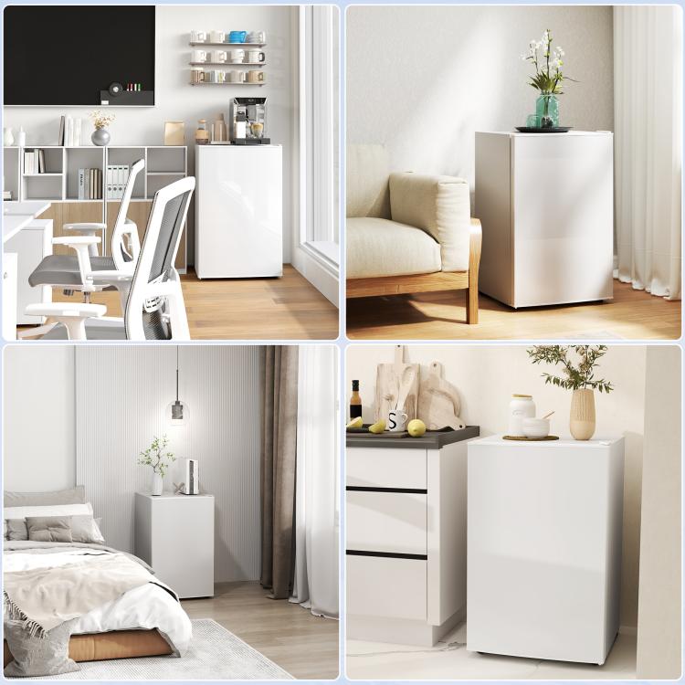 White mini fridge with single door and freezer, standing on wheels in a room