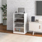 White media cabinet with clear glass doors and stacked shelves for records and consoles