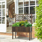 Dark wood raised planter with trellis on a patio near windows and greenery