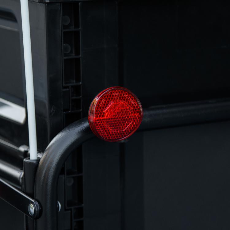 Bike cargo trailer red rear reflector on black frame