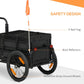 Bicycle cargo trailer with orange flag, red reflectors, and reflective wheel strips
