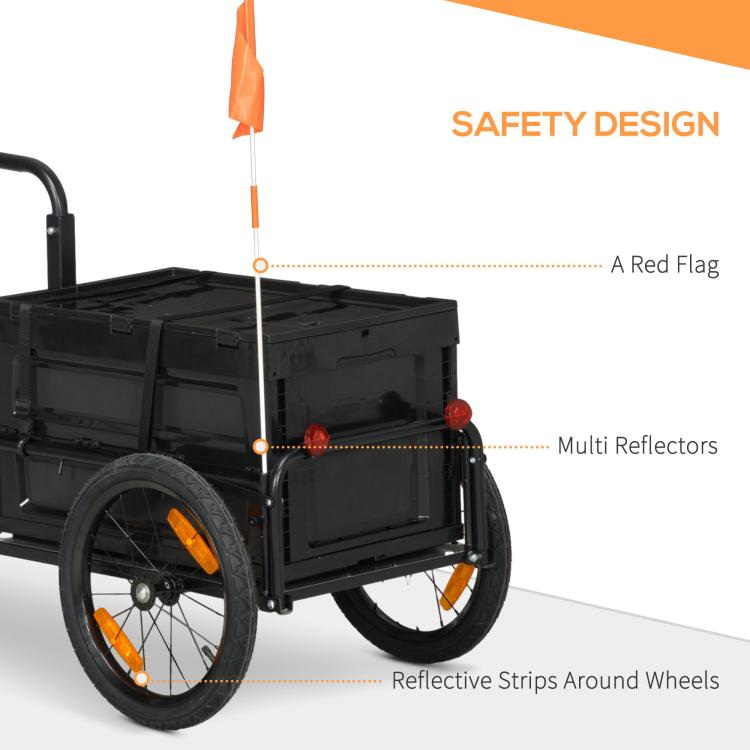 Bicycle cargo trailer with orange flag, red reflectors, and reflective wheel strips