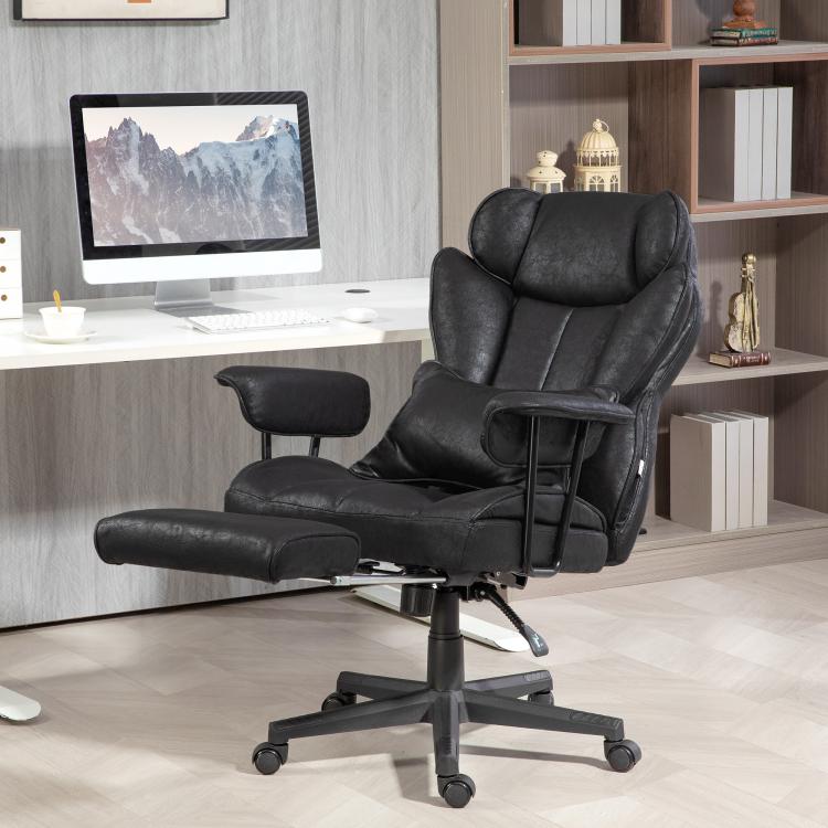 Black executive office chair with footrest, padded armrests, and reclining seat