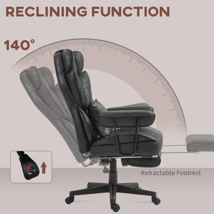 Black recline office chair with footrest extended and padded headrest