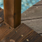 Close-up of wooden deck boards and railing post joint with metal screws