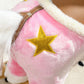 Pink plush rocking horse saddle with gold star patch and brown trim