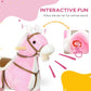 Pink plush rocking horse with sound ear feature and brown bridle on wooden rockers