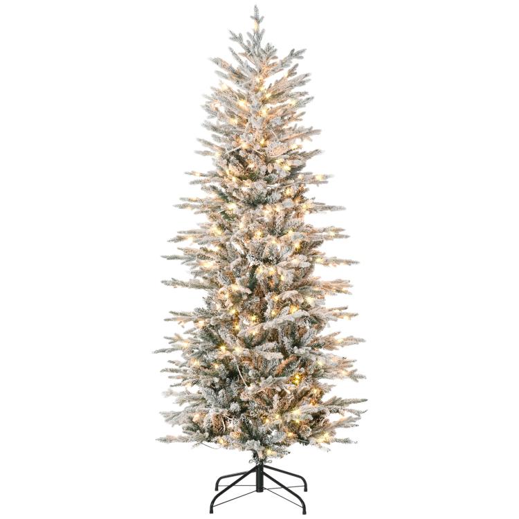 Snowy pre-lit artificial Christmas tree on black stand, warm white lights.
