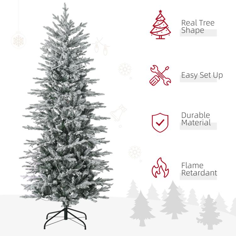 Snow-dusted artificial Christmas tree with dense branches and full profile